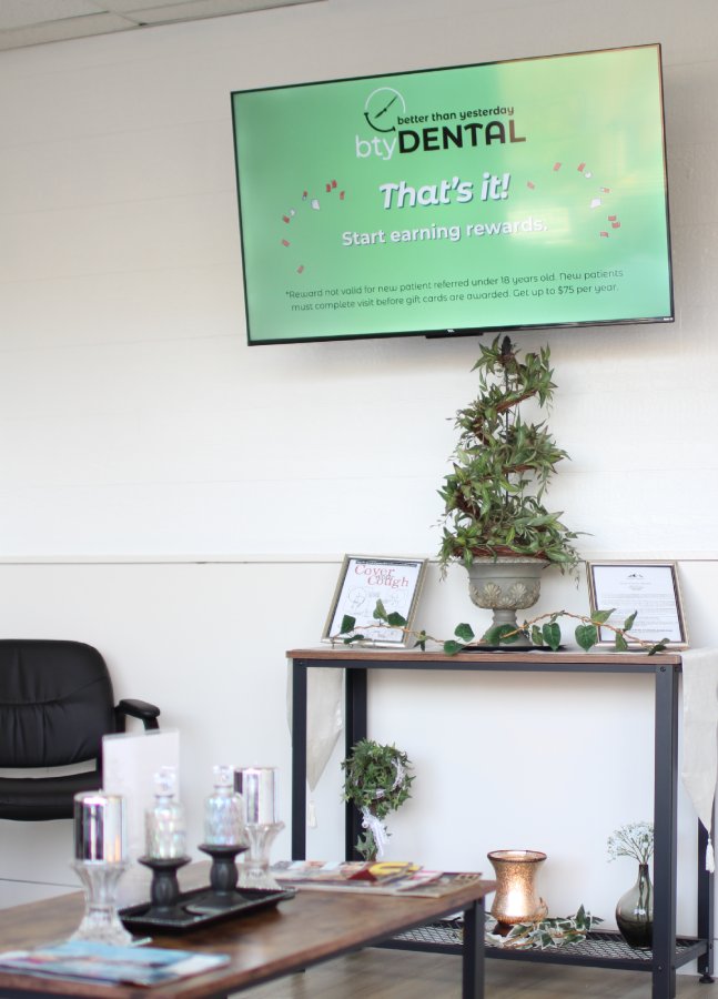 woman checking teeth - Dental Crowns