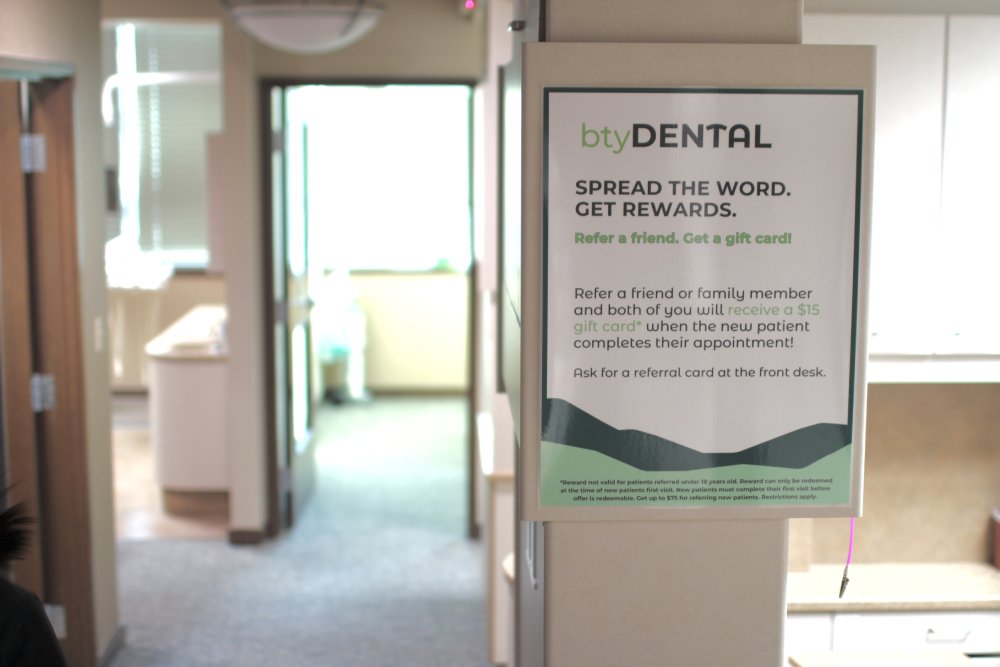 Young woman holding the hand of a sick tooth - dental emergency