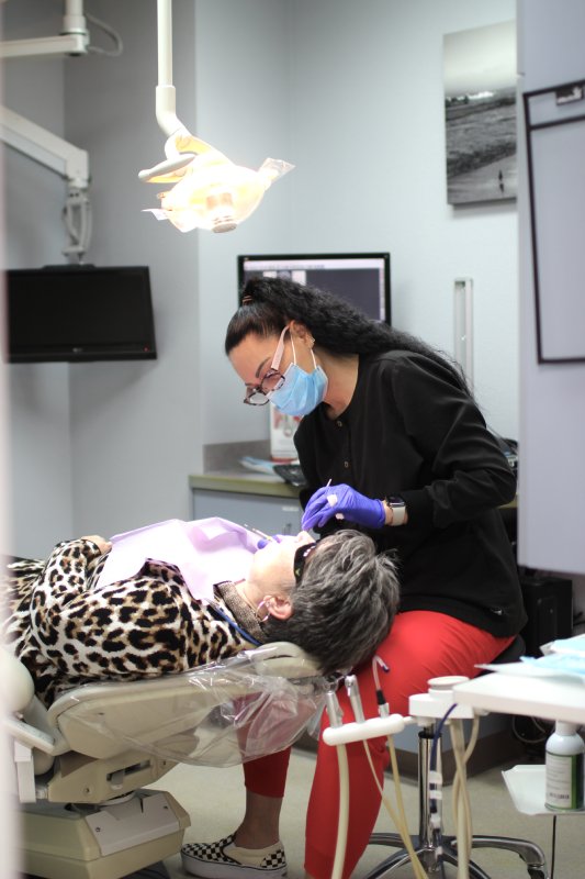 woman having dental cleaning and exam