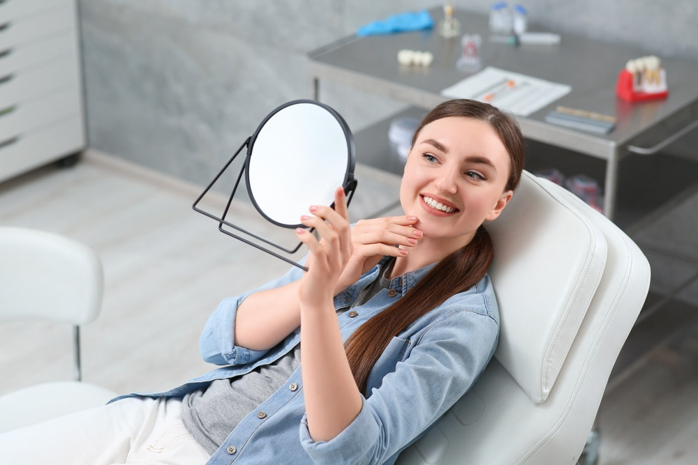 Woman checking teeth - Dental Fillings in Federal Way