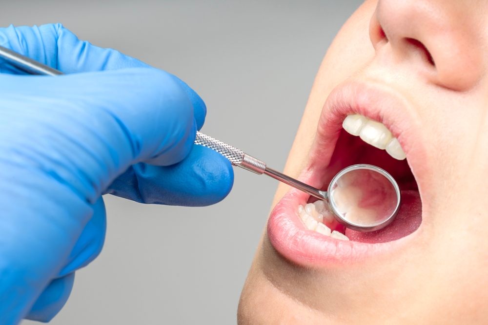 Dentist checking teeth of patient - Dentist in Lynnwood WA Dentist checking teeth of patient - Dentist in Lynnwood WA