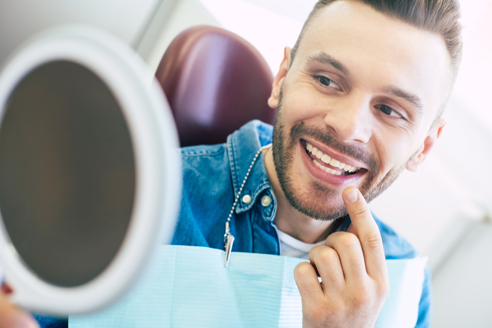 Man checking on his teeth - Veneers in Lynnwood WA Man checking on his teeth - Veneers in Lynnwood WA