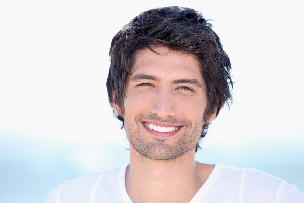 portrait of beaming young man - teeth whitening portrait of beaming young man - teeth whitening