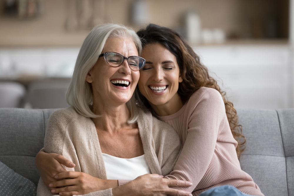 Happy mother and daughter hugging - Dental Bonding Happy mother and daughter hugging - Dental Bonding